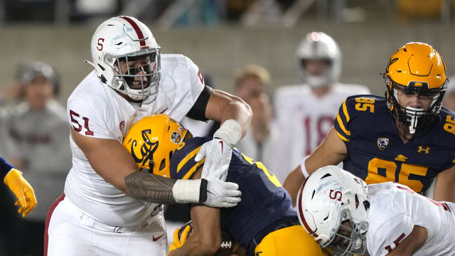 Nov 19, 2022; Berkeley, California, USA; Stanford Cardinal defensive lineman Jaxson Moi (51) tackles California Golden Bears running back Jaydn Ott (6) during the fourth quarter at FTX Field at California Memorial Stadium. Mandatory Credit: Darren Yamashita-USA TODAY Sports 